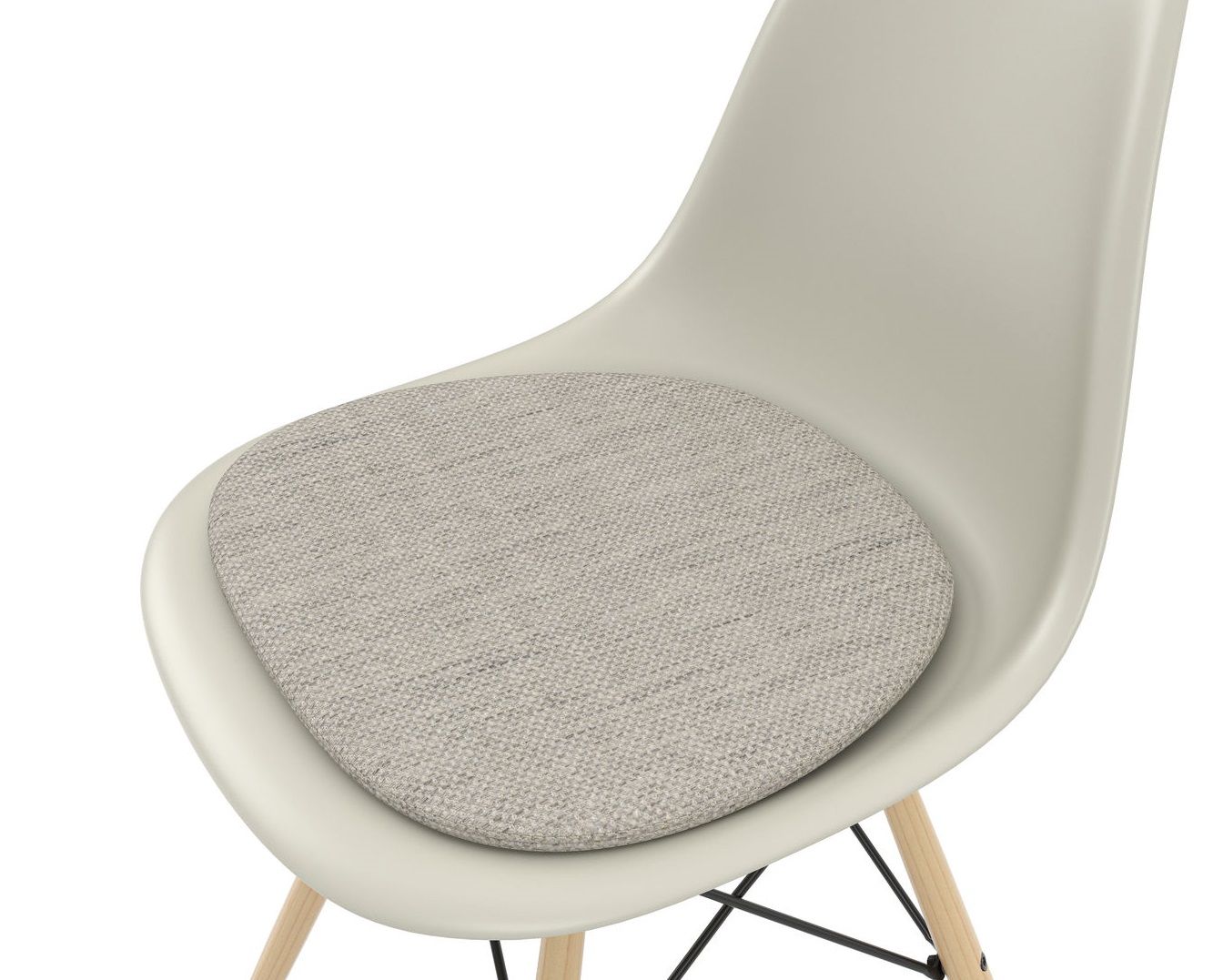 Detailaufnahme: Eames Plastic Side Chair DSW Stuhl von Vitra mit grauem Sitzpolster für erhöhten Komfort.