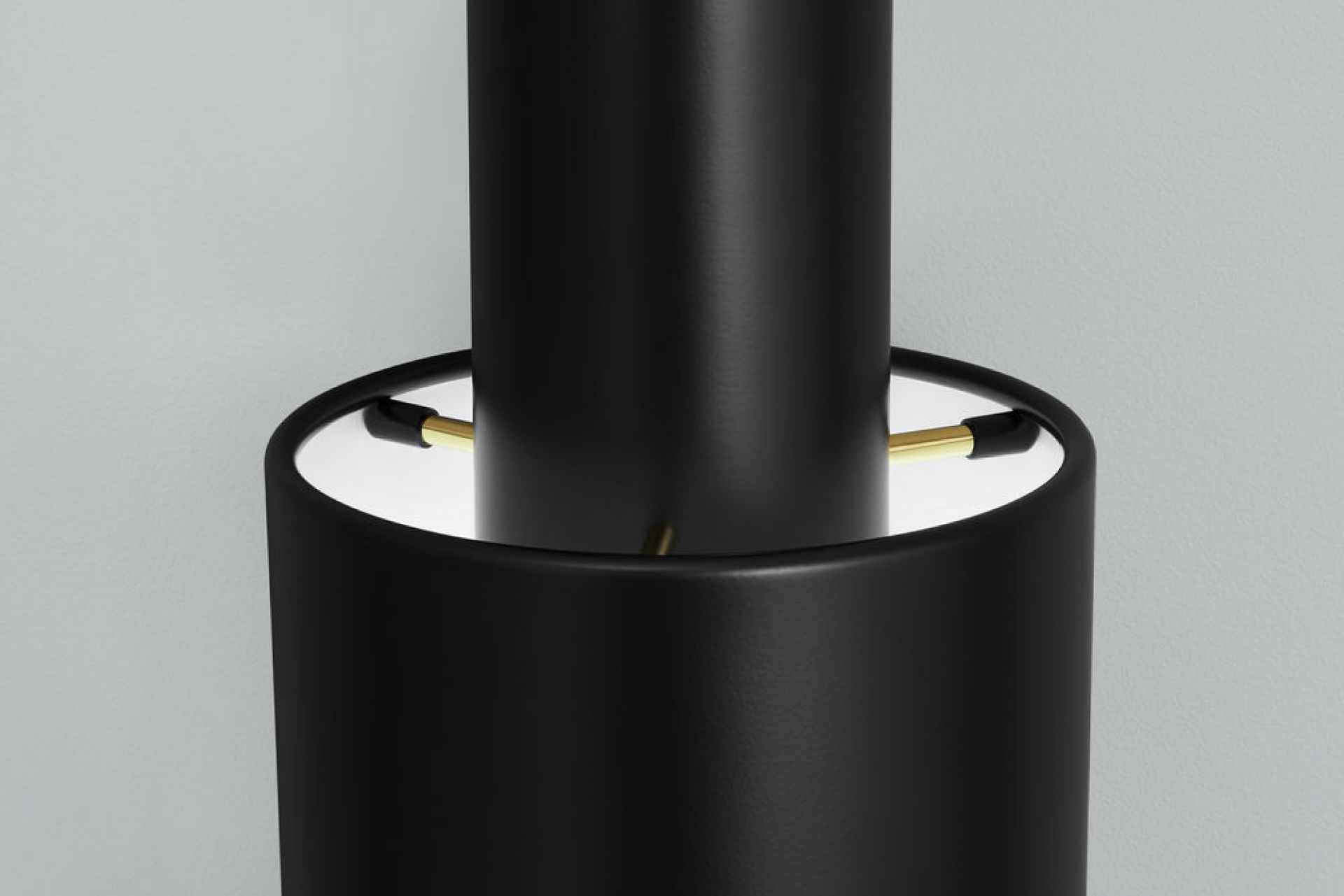 Detailaufnahme der schwarzen A110 Pendelleuchte von Artek, modernes Design mit goldenen Akzenten.