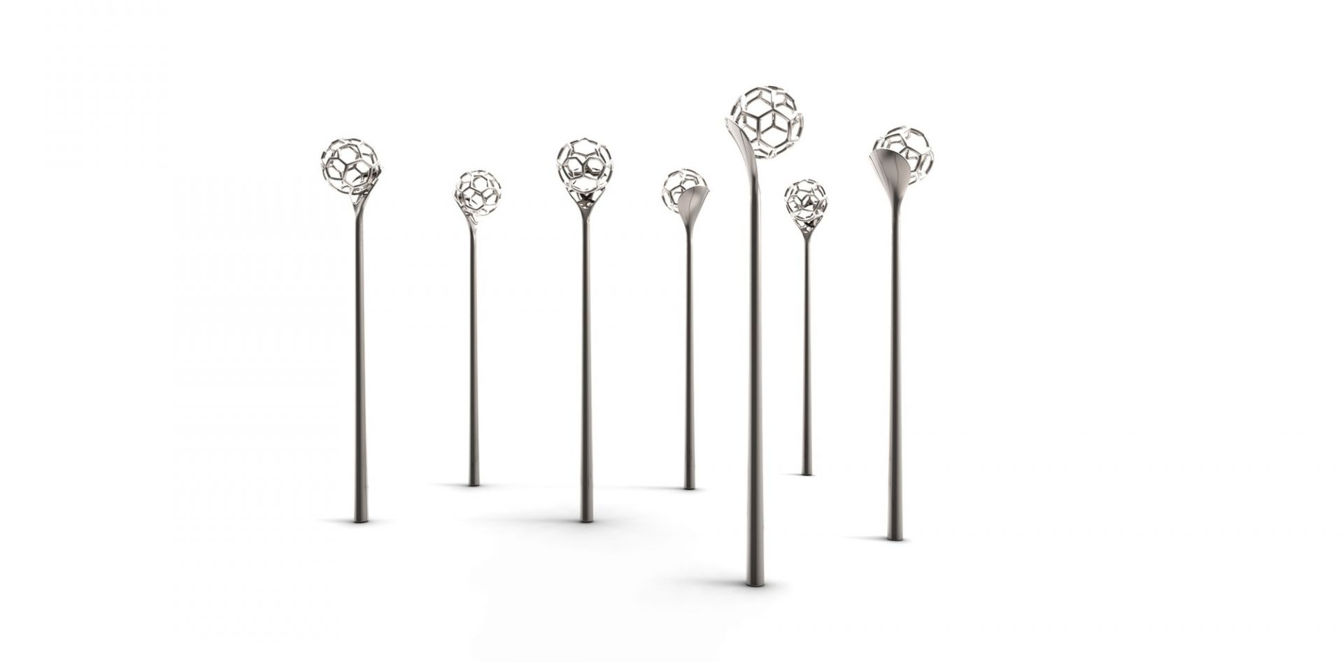 Mehrere Alessi Honiglöffel mit filigranem Kugeldesign, ideal für Honig und süße Aufstriche.