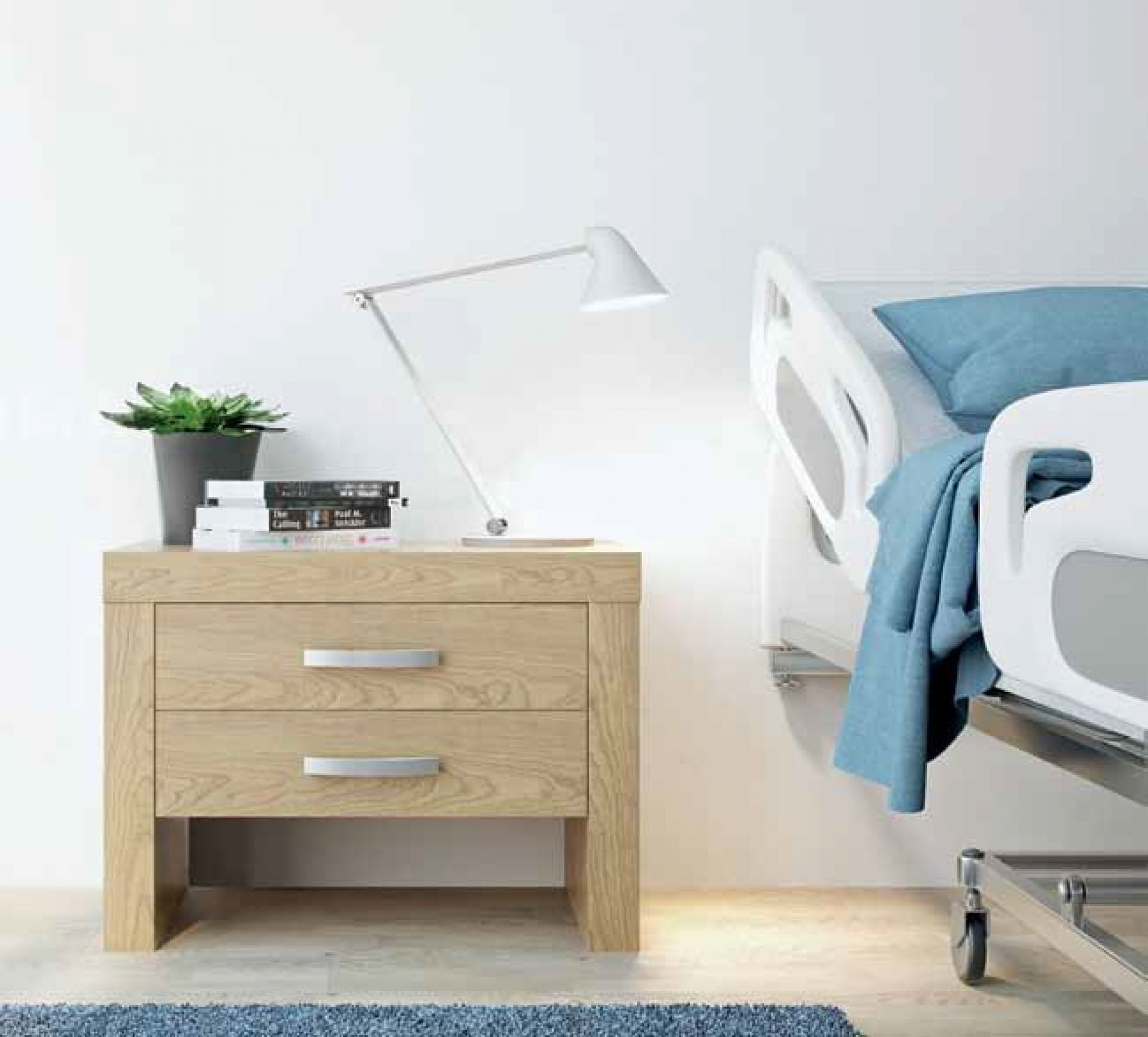 Weiße NJP Tischleuchte von Louis Poulsen auf einem Nachttisch neben einem Krankenhausbett.