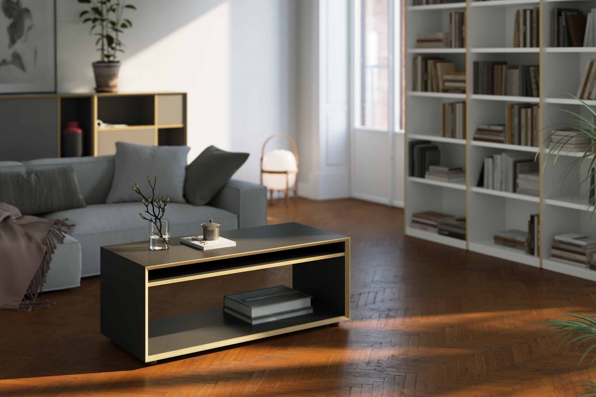 Vertiko Loop Beistelltisch von Müller Möbelwerkstätten im Wohnzimmer mit Sofa und Bücherregal.