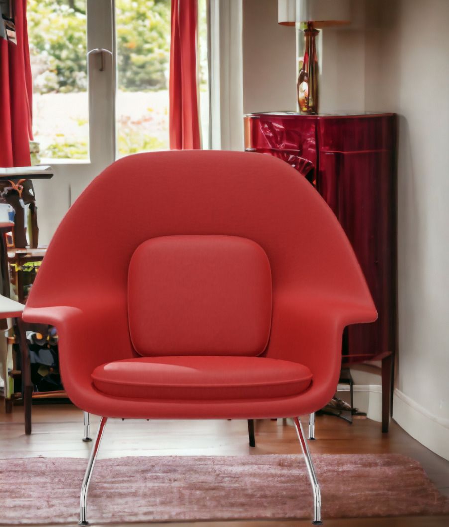 Roter Womb Chair Sessel von Knoll International mit verchromten Beinen in einem Wohnzimmer.