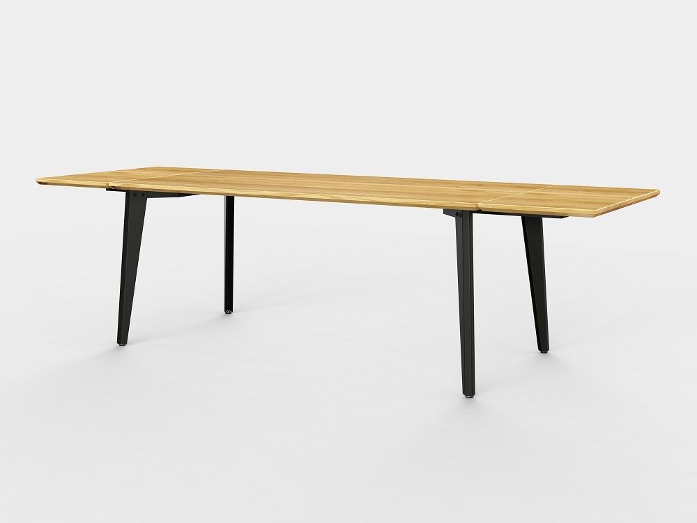 Plog Tisch von Jan Cray, ausziehbar, mit heller Holzplatte und schwarzen Beinen.