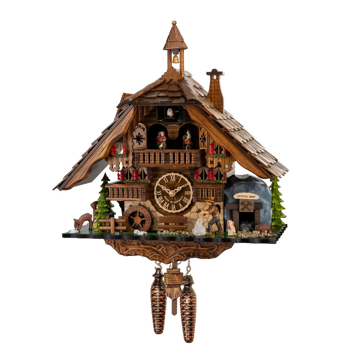 Detailaufnahme einer Engstler Quarz-Kuckucksuhr mit Musik, Tanzpaar und detailreichen Holzschnitzereien.