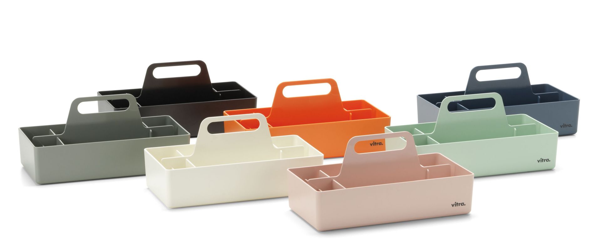 Mehrere Vitra Toolbox RE Organisationsboxen in verschiedenen Farben, darunter Mintgrün, für Büro und Zuhause.