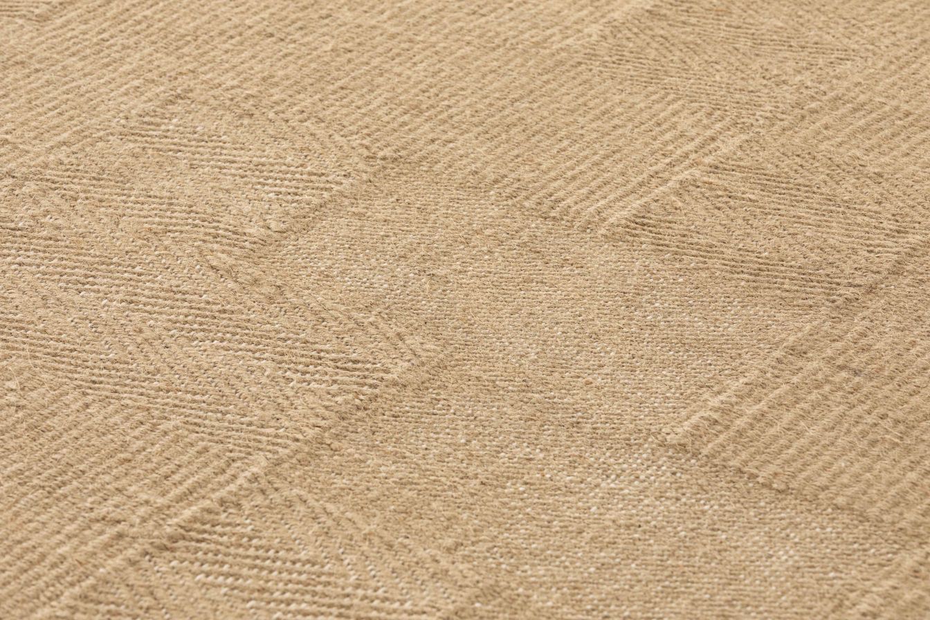 Detailaufnahme des beigen Roots Teppichs von Gan mit feiner Webstruktur und natürlicher Farbgebung.