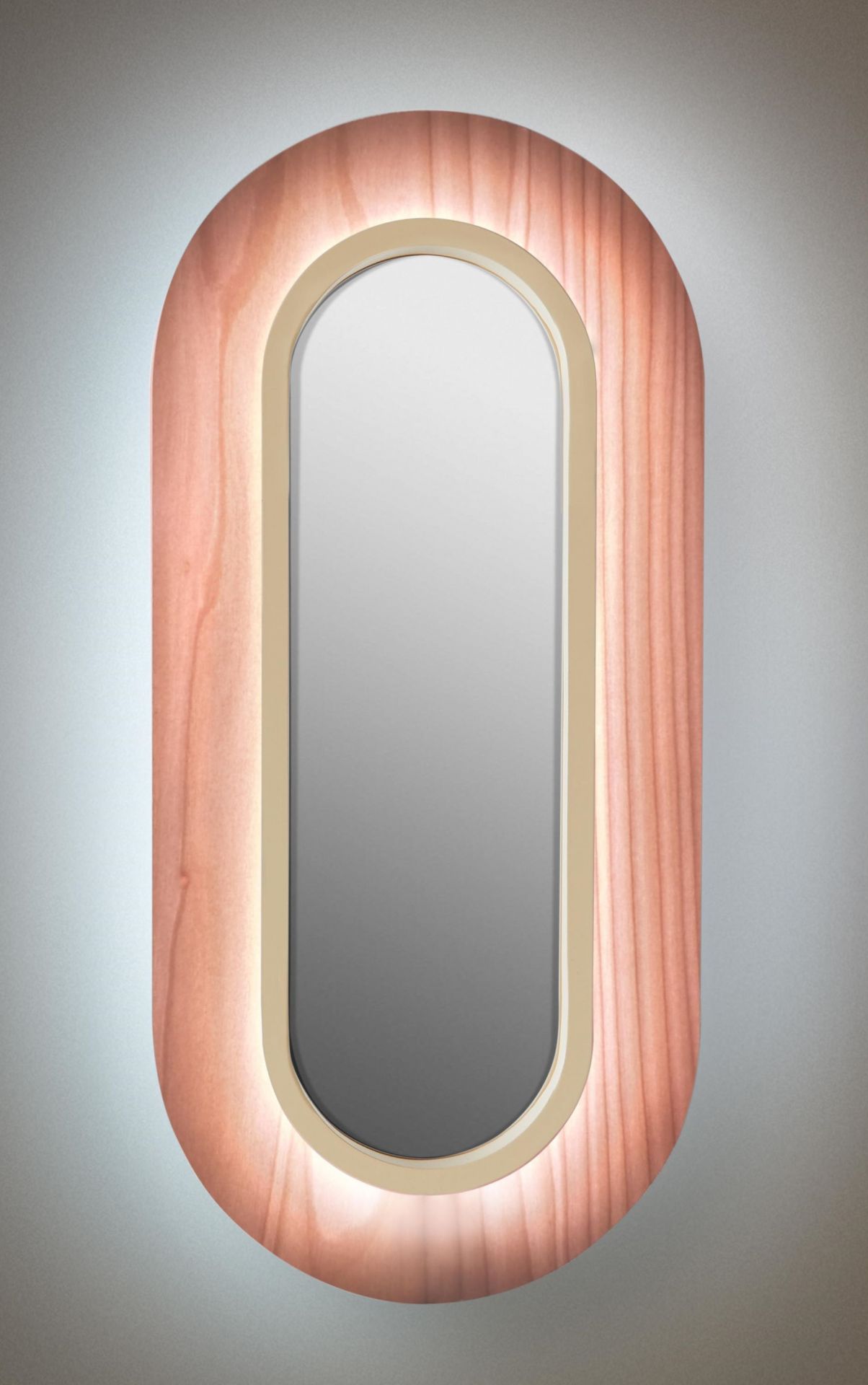 Lens LED Wandleuchte von LZF Lamps: Ovale Wandlampe mit elfenbeinweißem Metallring und hellrosa Holz.