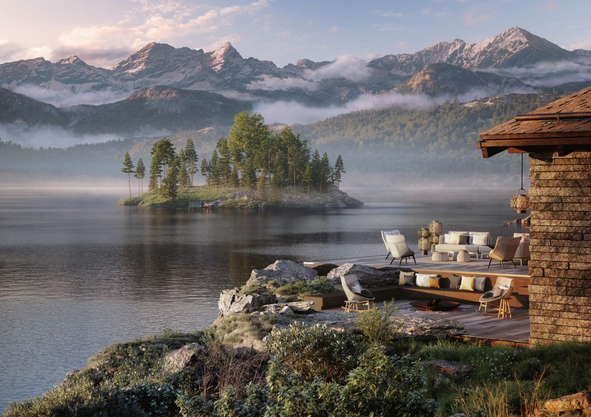 Mbrace Club Chair mit Sitzkissen von Dedon auf einer Terrasse mit Seeblick.