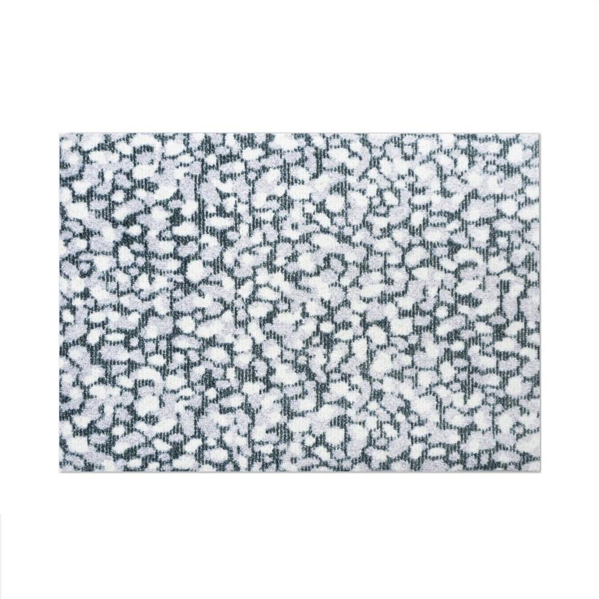 Heymat Grain Fußmatte mit abstraktem Granit-Muster in Grau und Weiß für den Innenbereich.