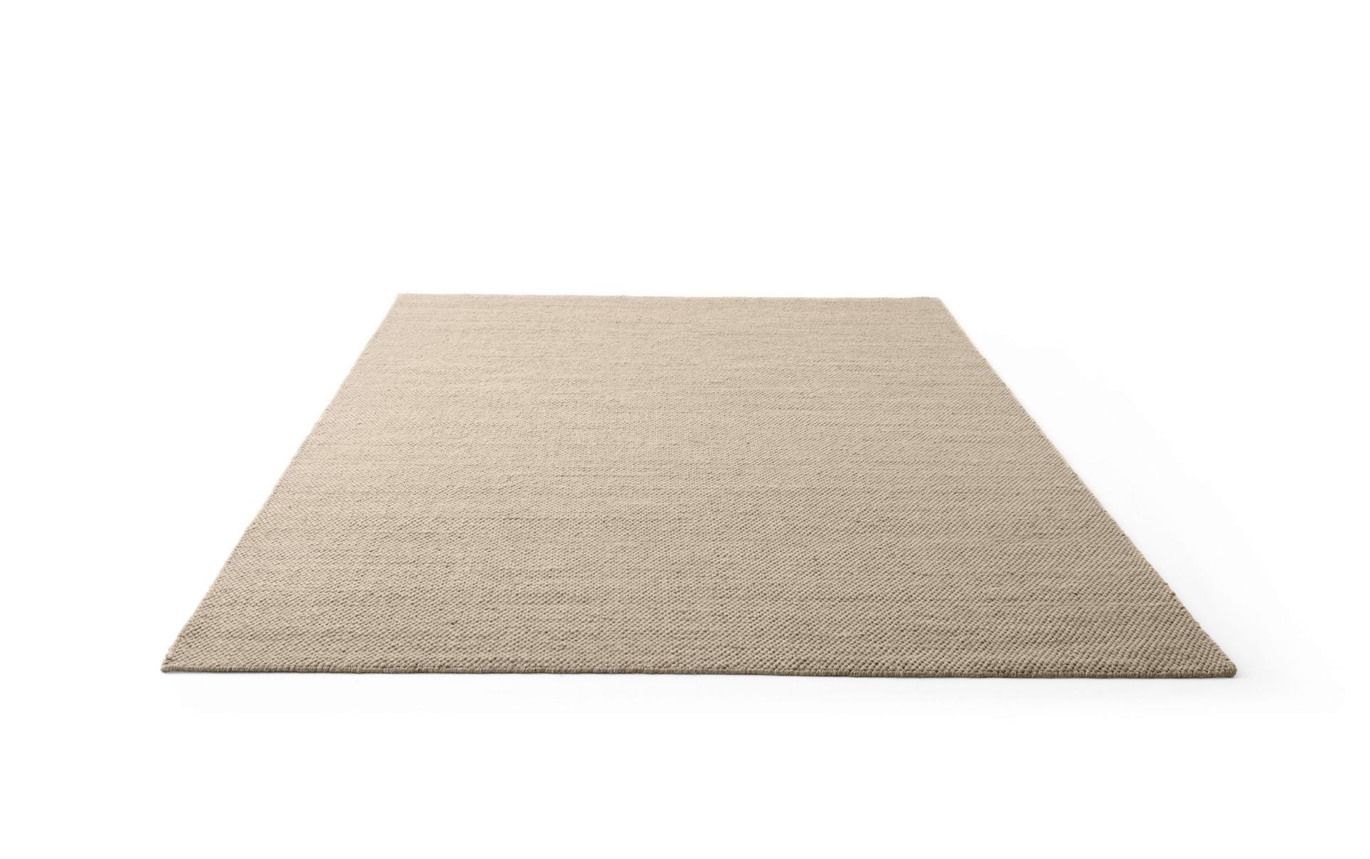 Vipp Wollteppich in Beige, Detailaufnahme des Teppichs mit feiner Textur, ideal für Wohnzimmer und Schlafzimmer.