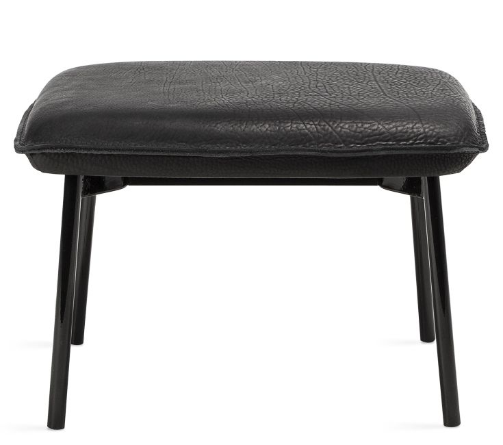 Schwarzer Grace Ottoman von Freifrau Manufaktur mit Lederbezug und filigranem Metallgestell.